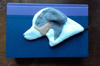Australian Shepherd used as a bookmark.
