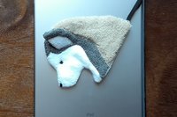 Smudge Dog attached to magnetic cover on popular tablet.