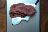Smudge Dog attached to magnetic cover on popular tablet.