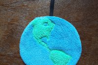 Clean Earth has an approximately 3 inch elastic loop for securing it.
