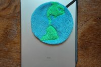 Looped through the magnetic cover of a popular tablet.