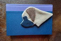 Smudge Dog used as a bookmark.