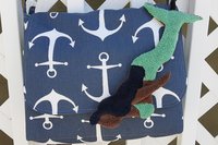 Mermaid attached to purse.
