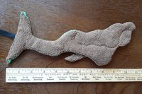 Back of Mermaid. Solid brown color.