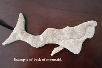 Back of Mermaid. Solid tan color.