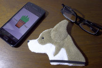 Smudge Dog with smart phone and glasses.