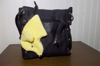 Smudge dog attached to a handbag always within reach.