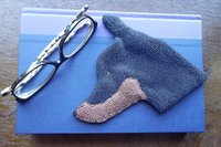 Smudge Dog used as a bookmark.