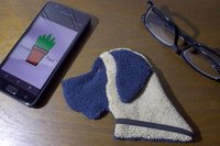 Smudge Dog with smart phone and glasses.