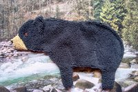Soft, microfiber terry cloth towels  made in the shape of a Black Bear.