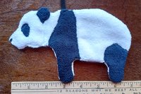 Smudge Bear shown with elastic loop with ruler in photo.