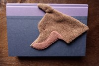 Smudge Dog being used as a bookmark.