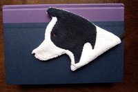 Smudge Dog used as a bookmark.