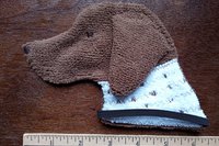 Smudge Dog with ruler to show size.
