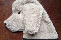 Soft, microfiber terry cloth towels cut, sewn, and made in the shape of a dog