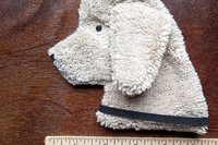 Smudge Dog with ruler to show size.