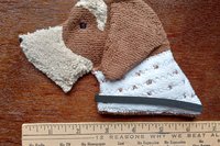 Smudge Dog with ruler to show size.