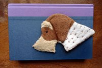 Smudge Dog being used as a bookmark