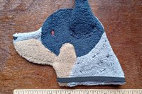 Smudge Dog with ruler to show size.