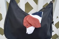 Smudge dog attached to a handbag always within reach.