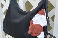 Smudge dog looped to a purse for easy access.