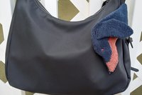 Smudge dog attached to a handbag always within reach.