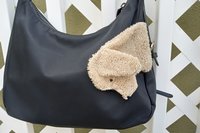 Smudge dog attached to handbag always within reach.