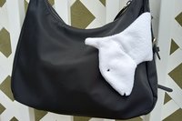 Smudge dog attached to a handbag always within reach.