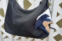 Smudge Dog attached to handbag, always easy to find and ready to clean