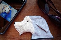 Smudge Dog with smart phone and glasses.