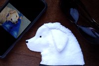 Smudge Dog with smart phone and glasses.