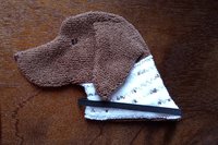 Soft, microfiber terry cloth towels cut, sewn, and made in the shape of a dog