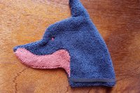 Soft, microfiber terry cloth towels cut, sewn, and made in the shape of a dog