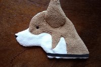 Soft, microfiber terry cloth towels cut, sewn, and made in the shape of a dog