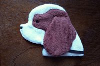 Soft, microfiber terry cloth towels cut, sewn, and made in the shape of a dog