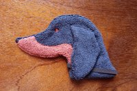 Soft, microfiber terry cloth towels cut, sewn, and made in the shape of a dog
