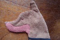 Soft, microfiber terry cloth towels cut, sewn, and made in the shape of a dog