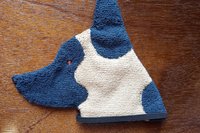Soft, microfiber terry cloth towels cut, sewn, and made in the shape of a dog