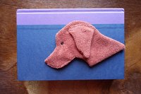 Smudge Dog being used as a bookmark.