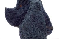 Soft, microfiber terry cloth towels cut, sewn, and made in the shape of a dog