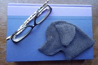 Black Labrador used as a bookmark.
