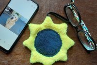 Sunflower with phone and glasses. Two of the items it can clean