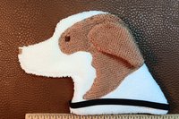 The Smudge Dog is shown with a ruler to illustrate size