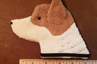 Smudge Dog shown with ruler to illustrate size
