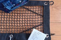 Purse and Handbag theft deterrent netting shown with hand bag and shopping list