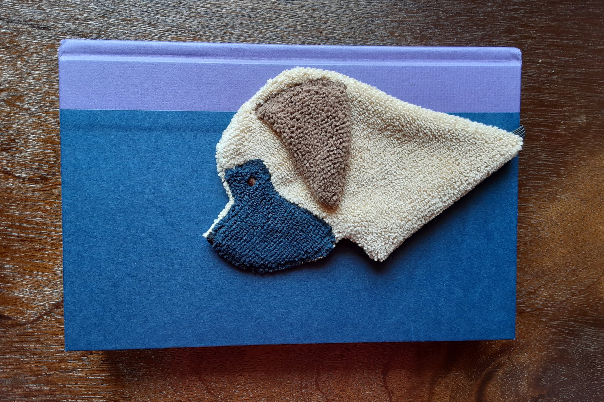 Smudge Dog used as a bookmark.
