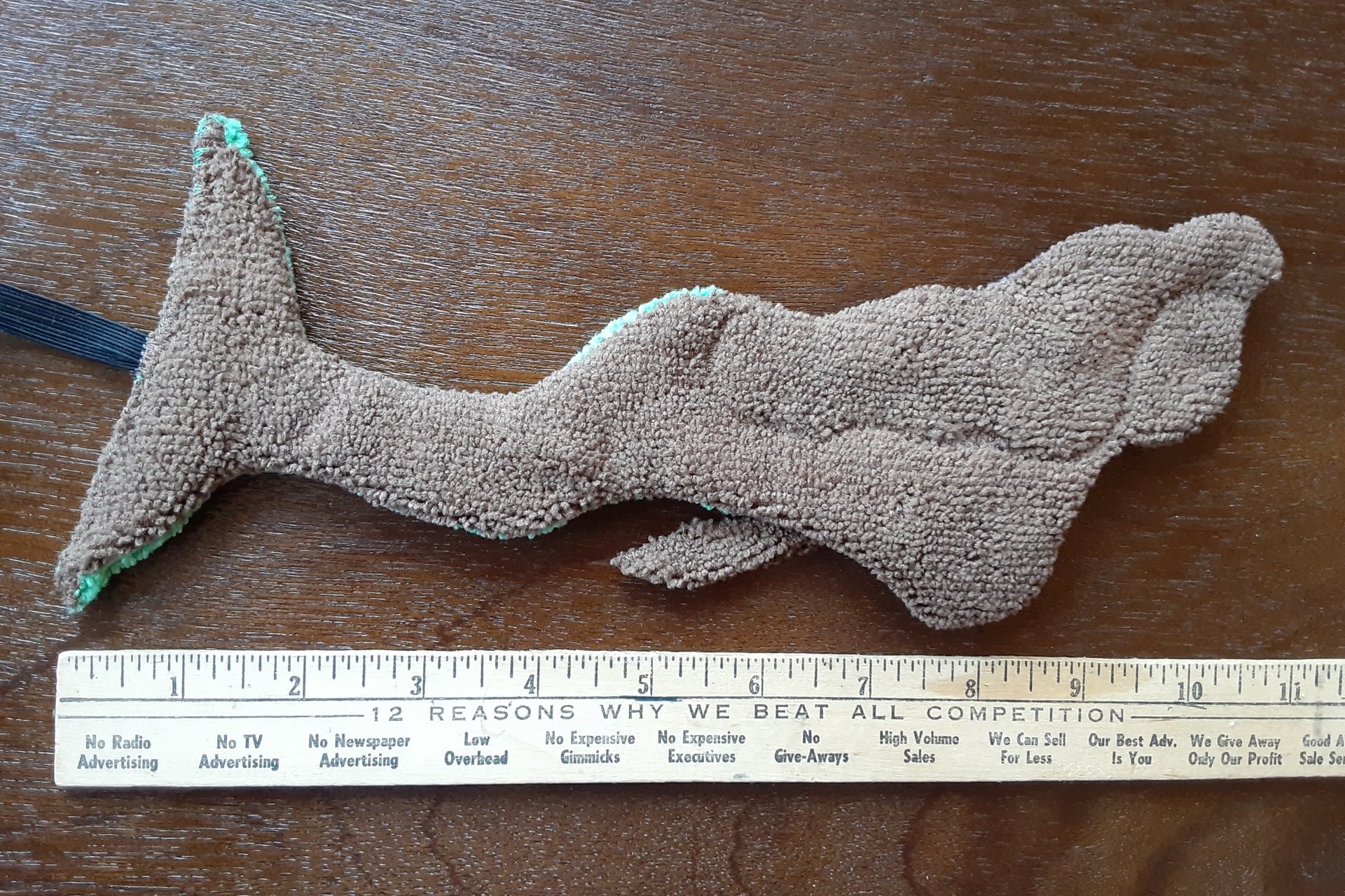 Back of Mermaid. Solid brown color.