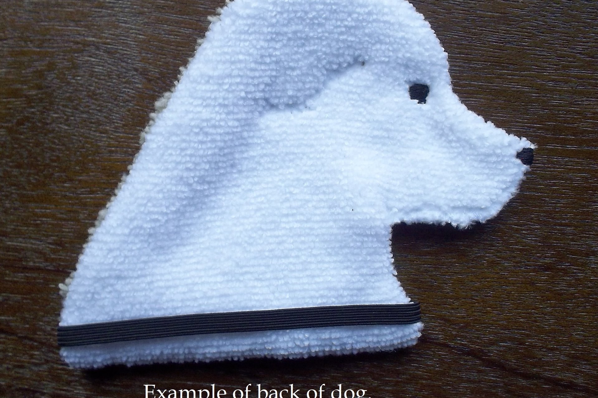 The backside of the dog. Solid white fabric.
