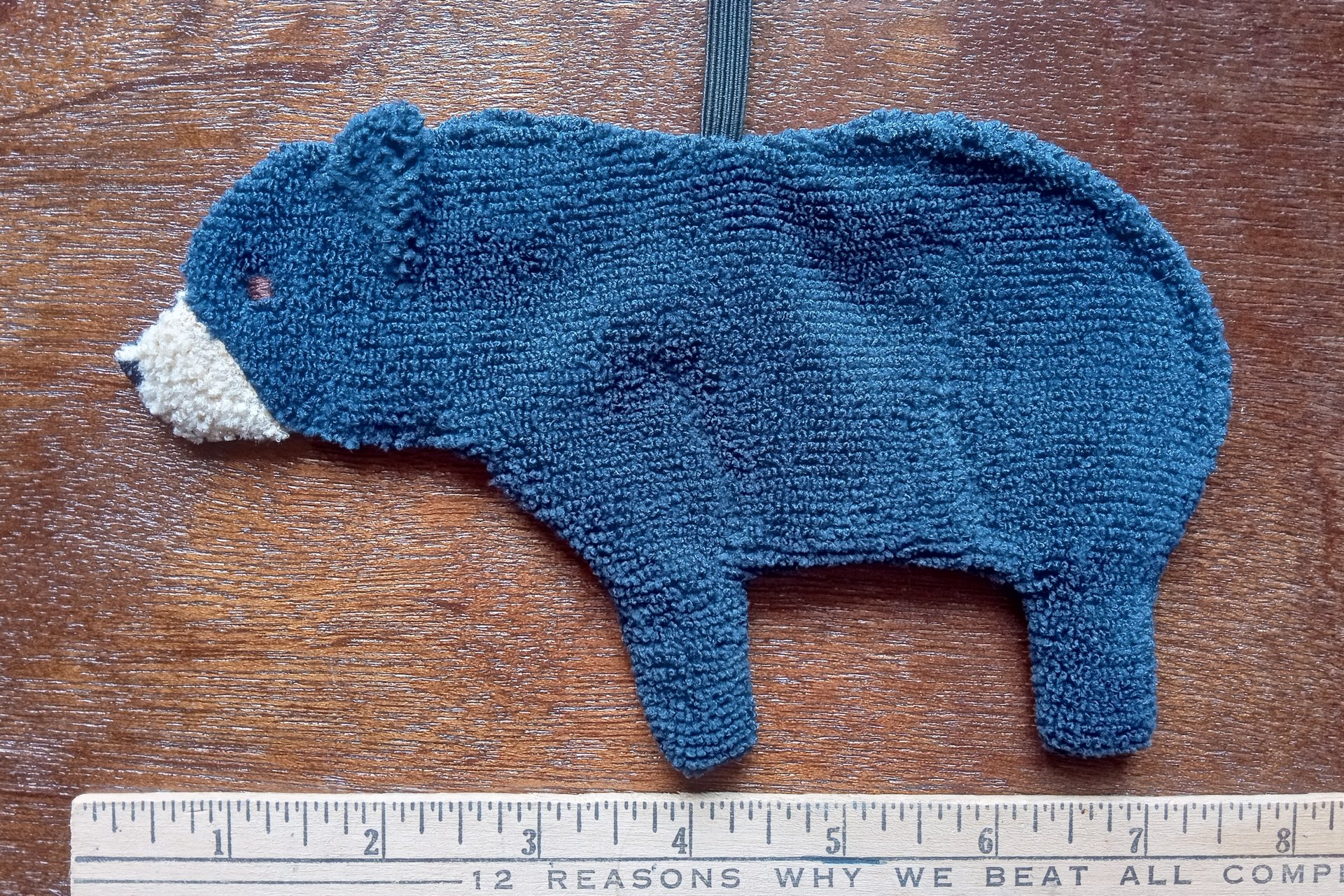 Smudge Bear shown with elastic loop with ruler in photo.