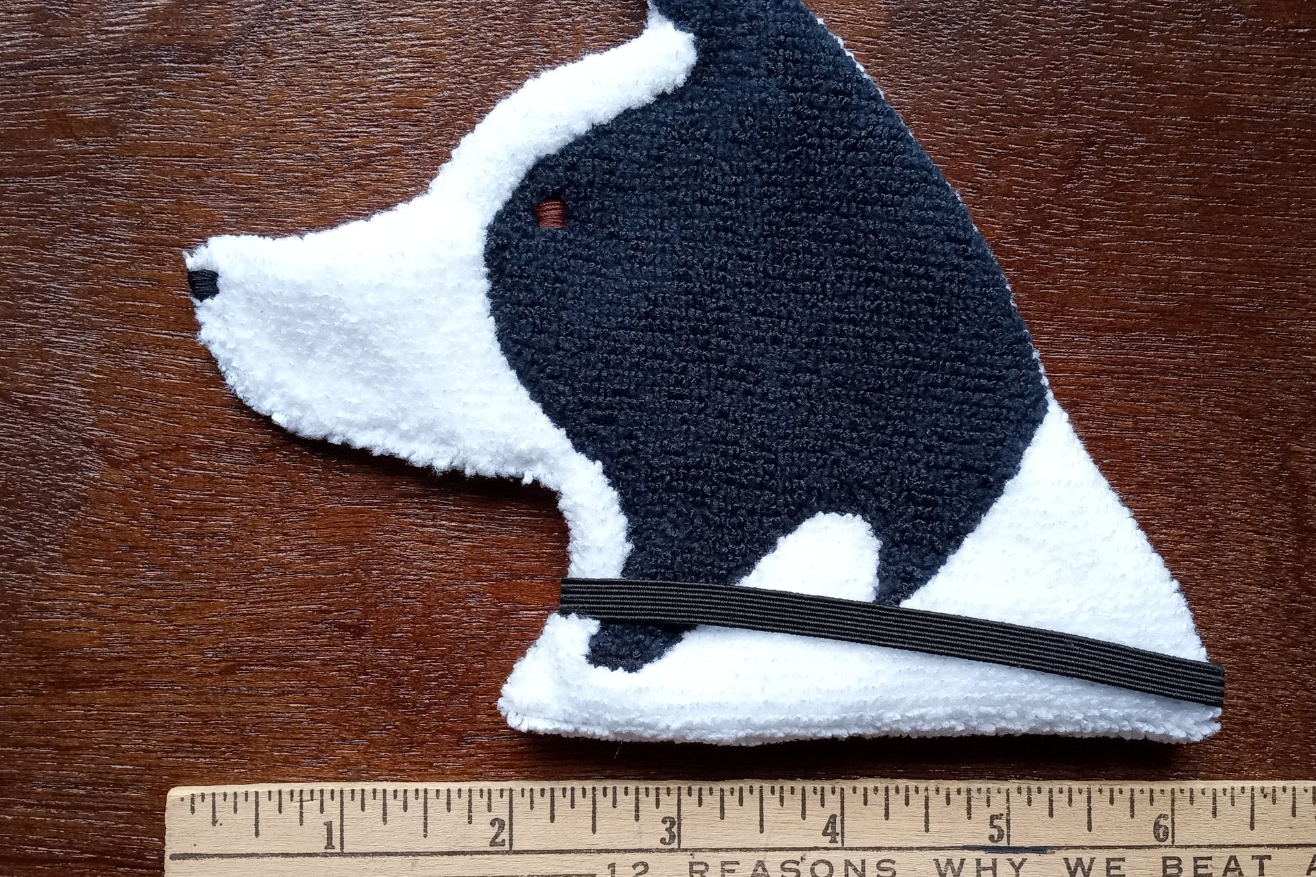 Smudge Dog shown with ruler to show size.